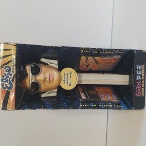 Gaint elvis per candy roll dispenser.